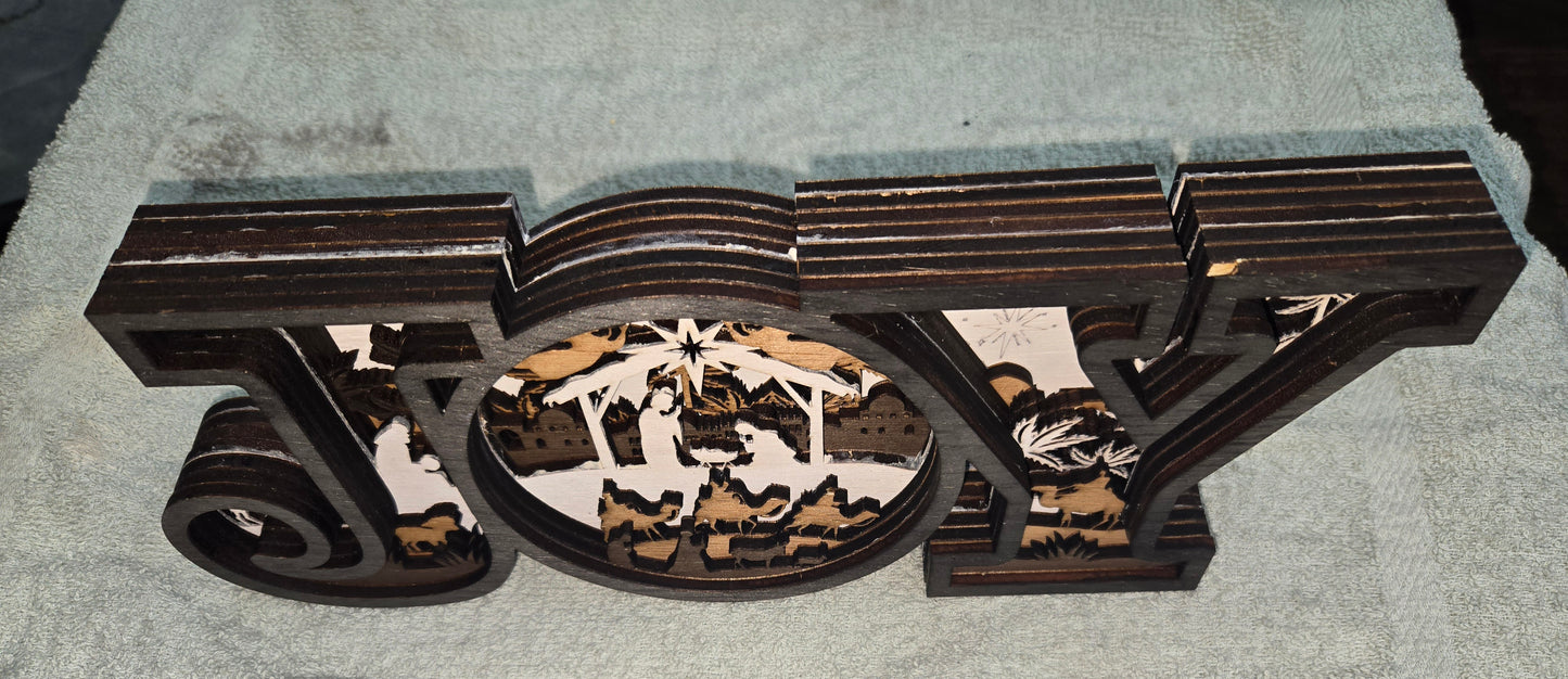 Decorative wooden 'JOY' Frame Design with Christmas nativity scene with 7-Layers
L x W x H = 17in x 1.5in x 5.5in
