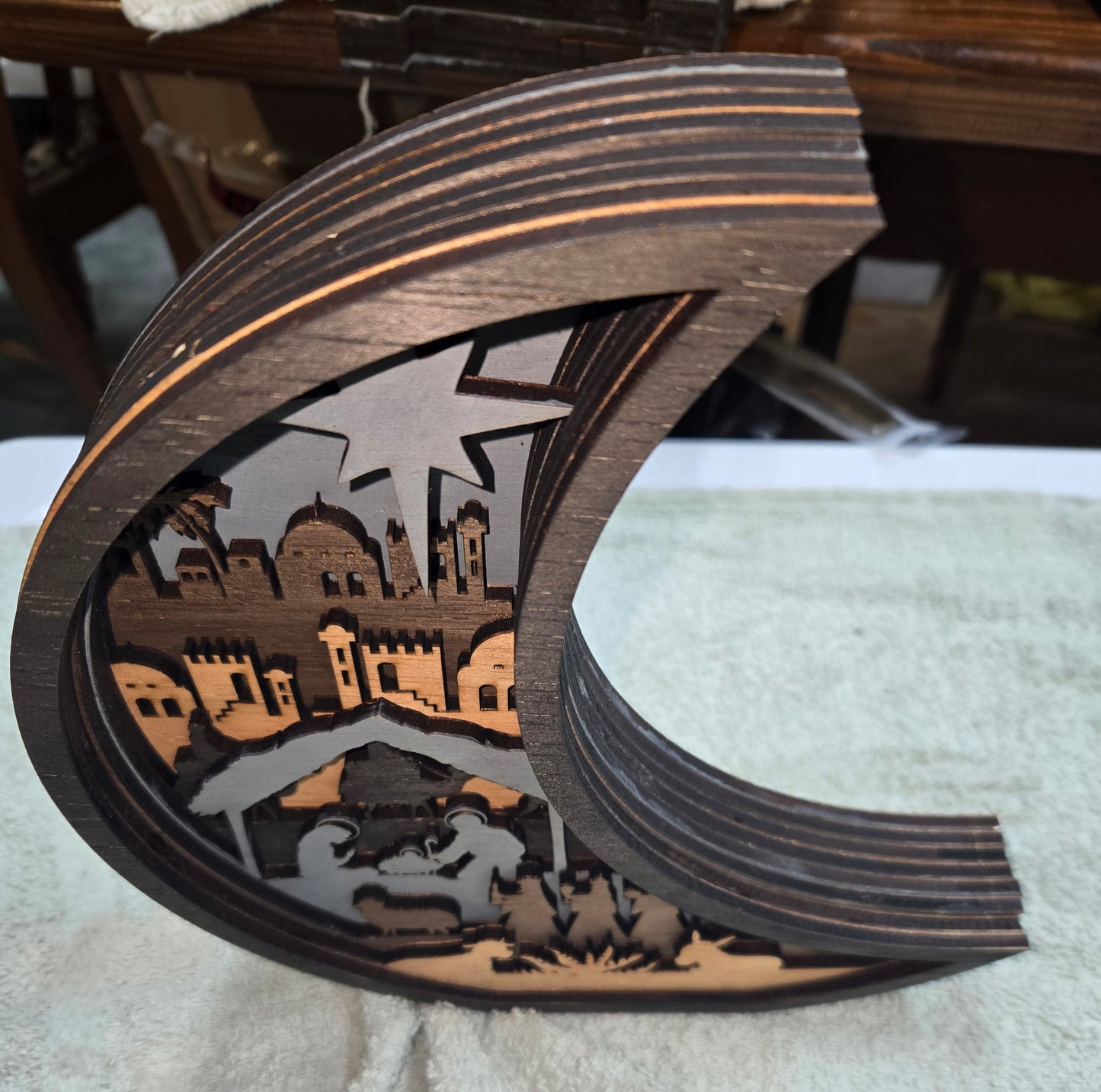 Wooden Nativity Christmas decoration 7-Layered scene cutout with a Moon Frame.
L x W x H = 10.5in x 1.5in x 11in
