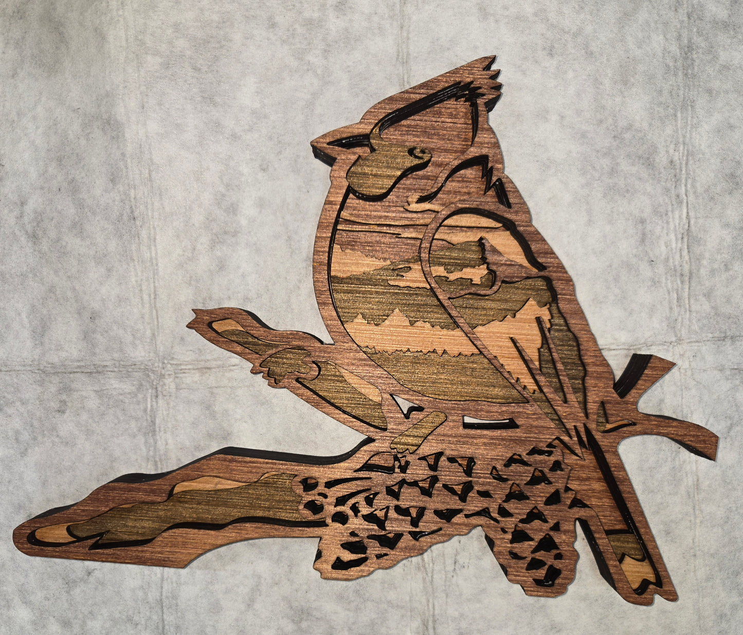 Multi-layered wall art that transcends traditional display limitations. This versatile multi-layered Red Bird functions seamlessly as a standalone accent for tables, countertops, and mantles, or mounts elegantly on walls for dramatic visual impact. Crafted with dimensional layering that creates depth and sophistication, it adapts to any interior design scheme. Whether you're seeking a focal point for a shelf, a statement piece above a fireplace, or a gallery wall installation, this art delivers professional