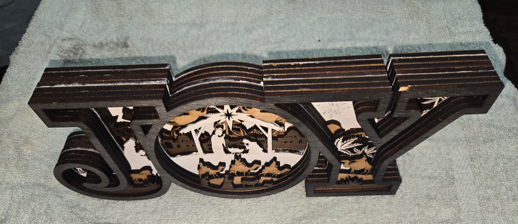Decorative wooden 'JOY' Frame Design with Christmas nativity scene with 7-Layers

L x W x H = 17in x 1.5in x 5.5in