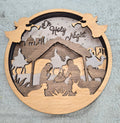 Wooden Nativity Christmas decoration 6-Layered scene  with 'Oh Holy Night' text on a gray background