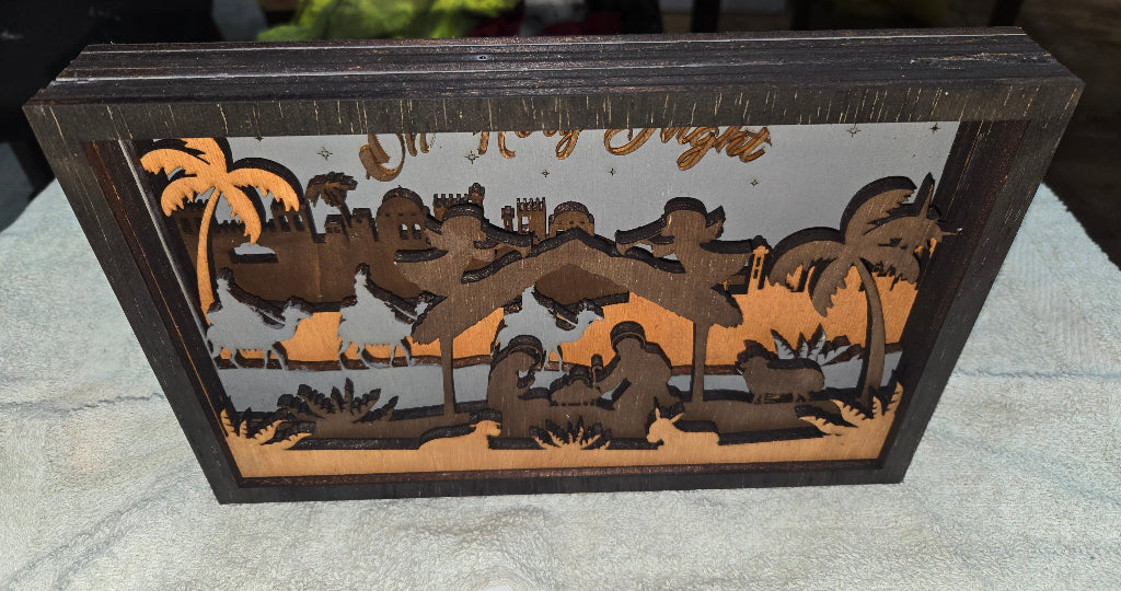 Wooden Nativity Christmas decoration 7-Layered scene with 'Oh Holy Night' text on a gray background