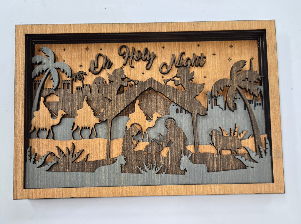 Wooden Nativity Christmas decoration 7-Layered scene cutout with 'Oh Holy Night' text with Brown background.

L x W x H = 11in x 1.5in x 7.25in