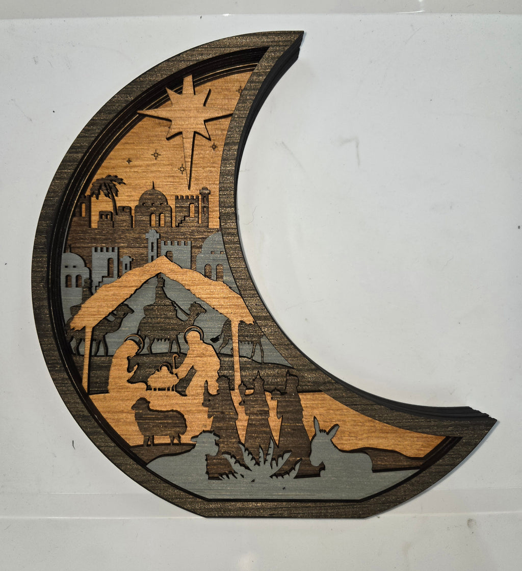 Wooden Nativity Christmas decoration 7-Layered scene cutout with a Moon Frame.

L x W x H = 10.5in x 1.5in x 11in