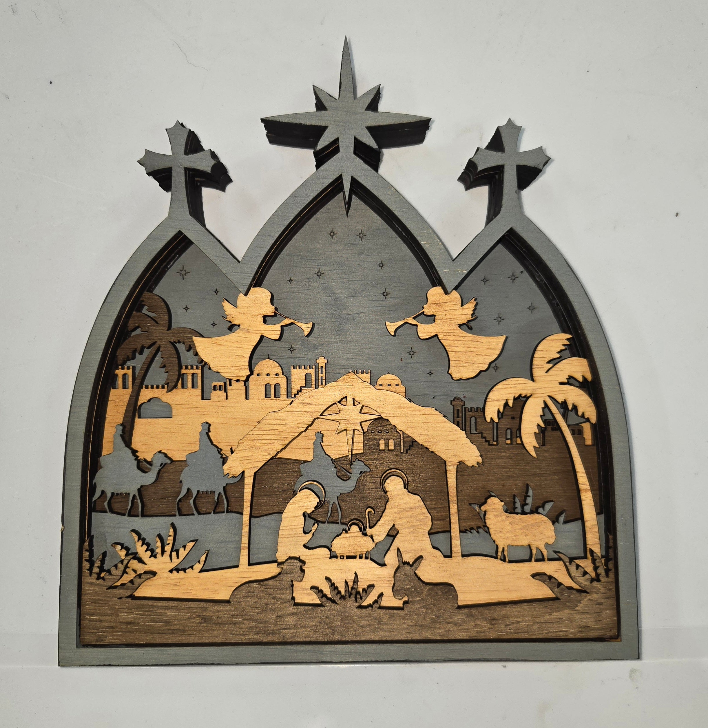 Wooden Nativity Christmas decoration 7-Layered scene cutout with a gray background

L x W x H = 9.5in x 1.5in x 10in