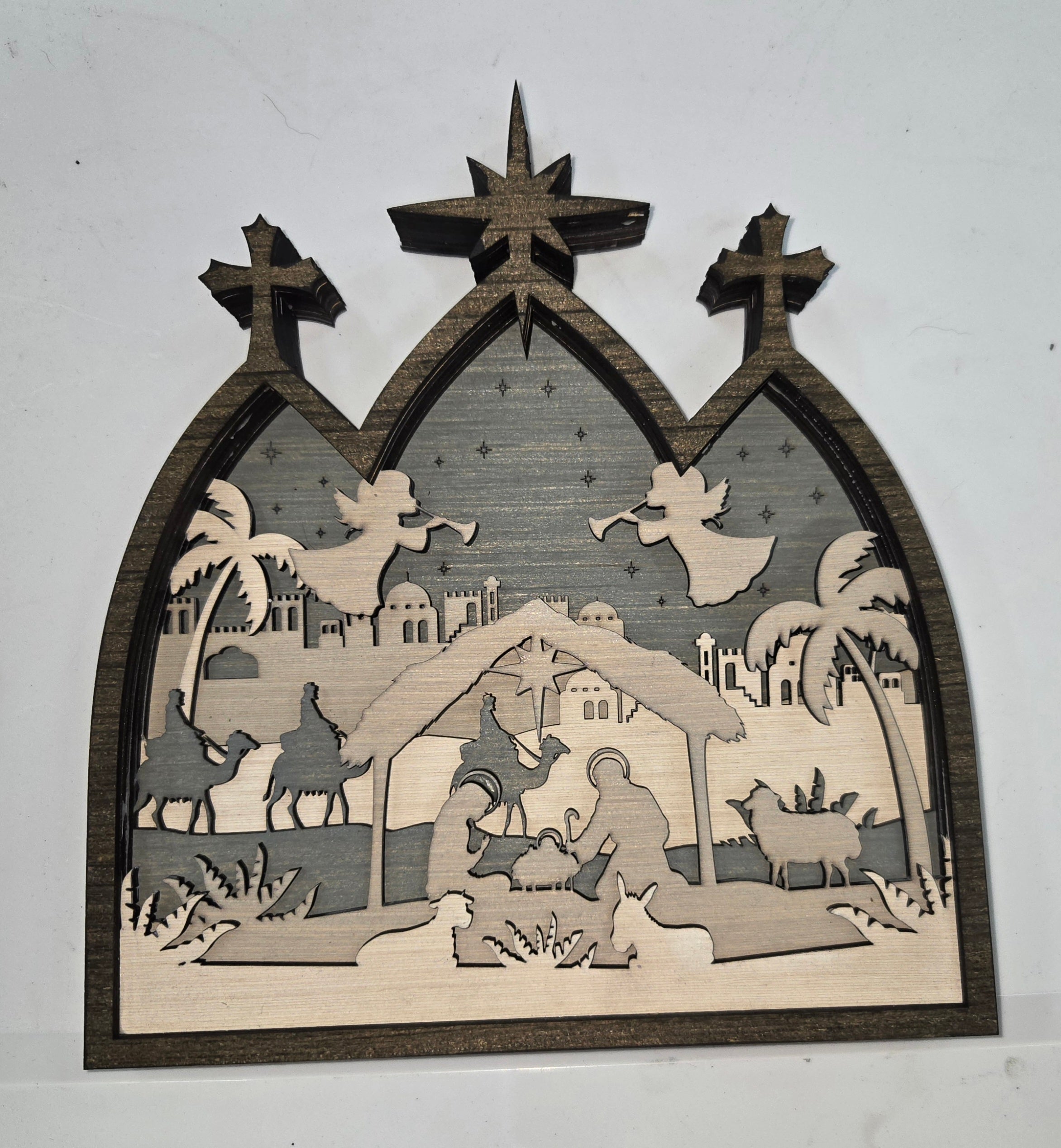 Wooden Nativity Christmas decoration 7-Layered scene cutout with a gray background

L x W x H = 9.5in x 1.5in x 10in