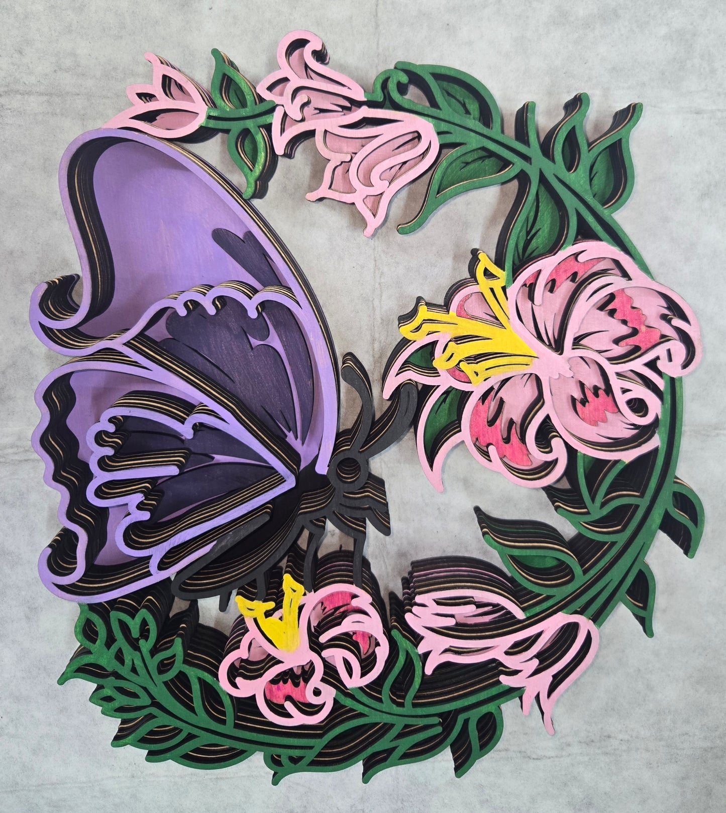 Multi-layered wall art that transcends traditional display limitations. This versatile multi-layered Butterfly on Flowers functions seamlessly as a standalone accent for tables, countertops, and mantles, or mounts elegantly on walls for dramatic visual impact. Crafted with dimensional layering that creates depth and sophistication, it adapts to any interior design scheme. Whether you're seeking a focal point for a shelf, a statement piece above a fireplace, or a gallery wall installation, this art delivers 