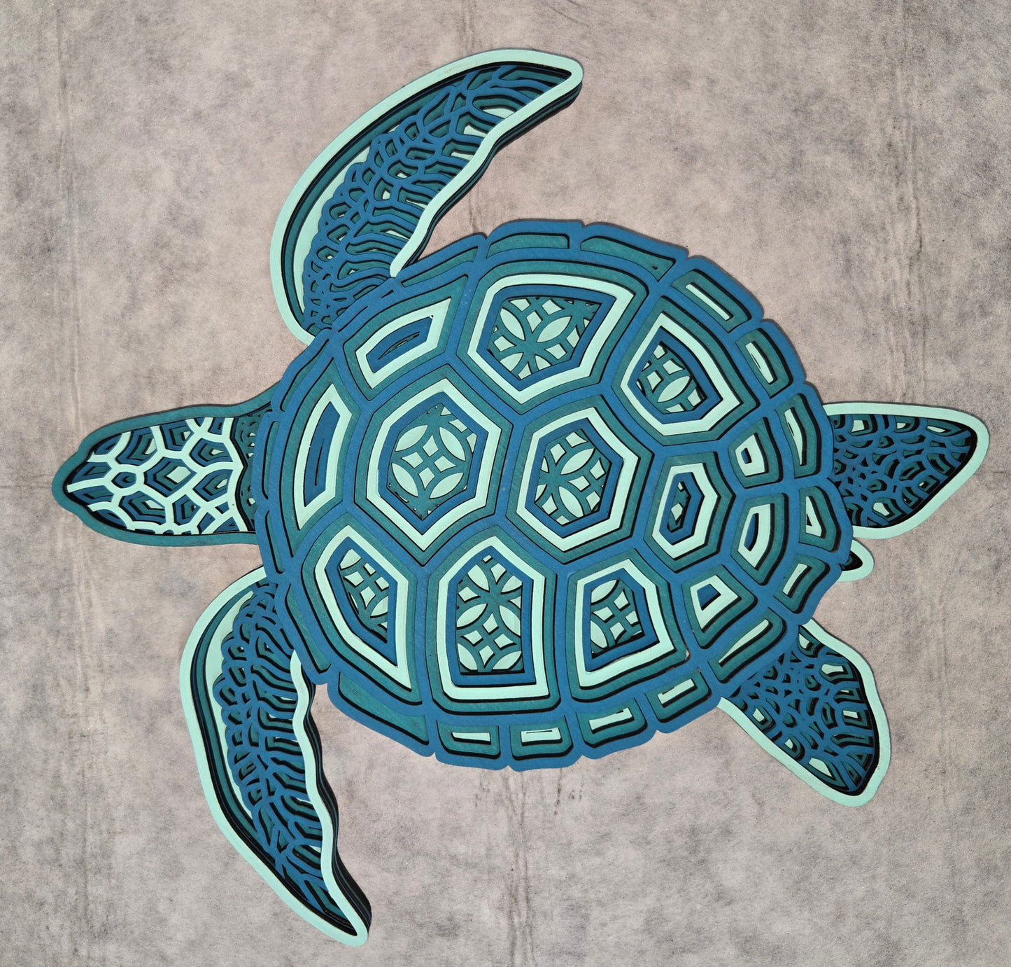 Multi-layered wall art that transcends traditional display limitations. This versatile multi-layered Turtle functions seamlessly as a standalone accent for tables, countertops, and mantles, or mounts elegantly on walls for dramatic visual impact. Crafted with dimensional layering that creates depth and sophistication, it adapts to any interior design scheme. Whether you're seeking a focal point for a shelf, a statement piece above a fireplace, or a gallery wall installation, this art delivers professional-g