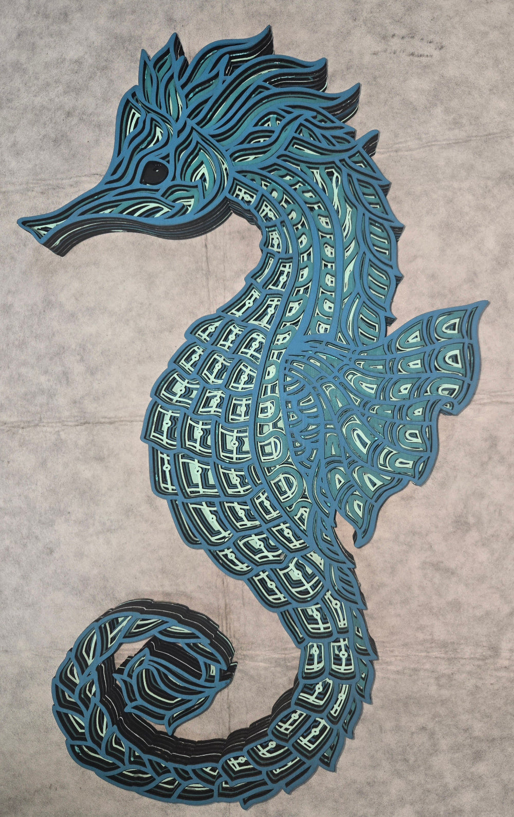 Multi-layered wall art that transcends traditional display limitations. This versatile multi-layered Seahorse Mandala functions seamlessly as a standalone accent for tables, countertops, and mantles, or mounts elegantly on walls for dramatic visual impact. Crafted with dimensional layering that creates depth and sophistication, it adapts to any interior design scheme. Whether you're seeking a focal point for a shelf, a statement piece above a fireplace, or a gallery wall installation, this art delivers prof