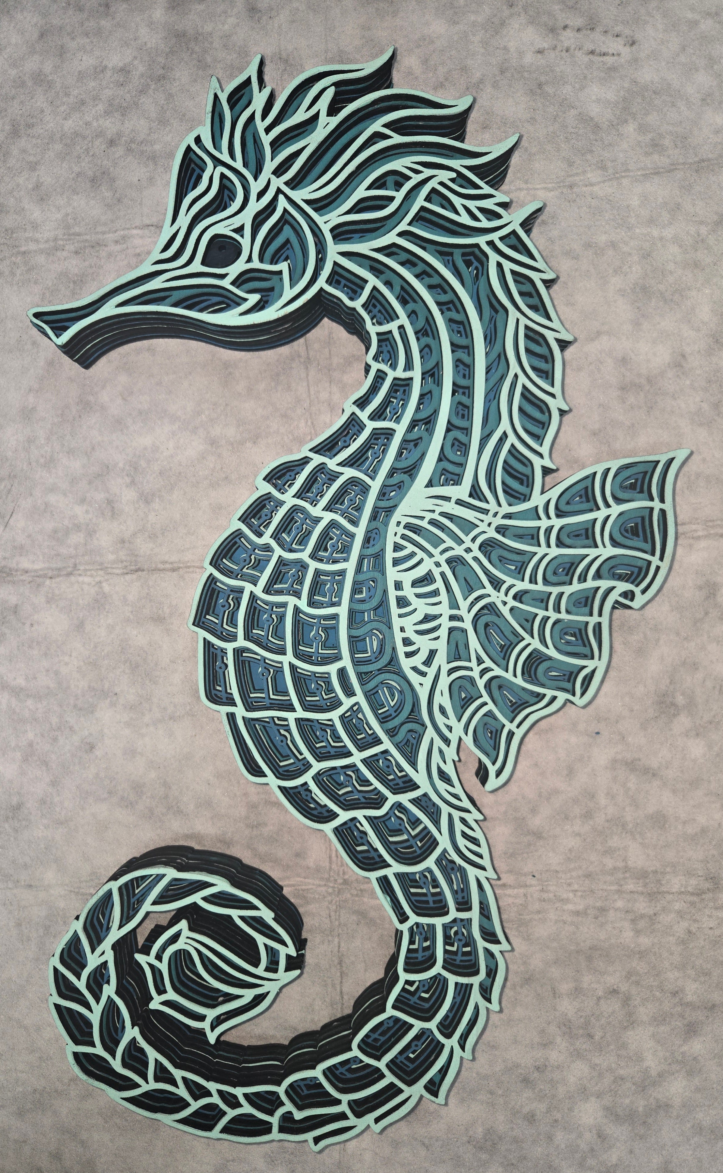 Multi-layered wall art that transcends traditional display limitations. This versatile multi-layered Seahorse Mandala functions seamlessly as a standalone accent for tables, countertops, and mantles, or mounts elegantly on walls for dramatic visual impact. Crafted with dimensional layering that creates depth and sophistication, it adapts to any interior design scheme. Whether you're seeking a focal point for a shelf, a statement piece above a fireplace, or a gallery wall installation, this art delivers prof