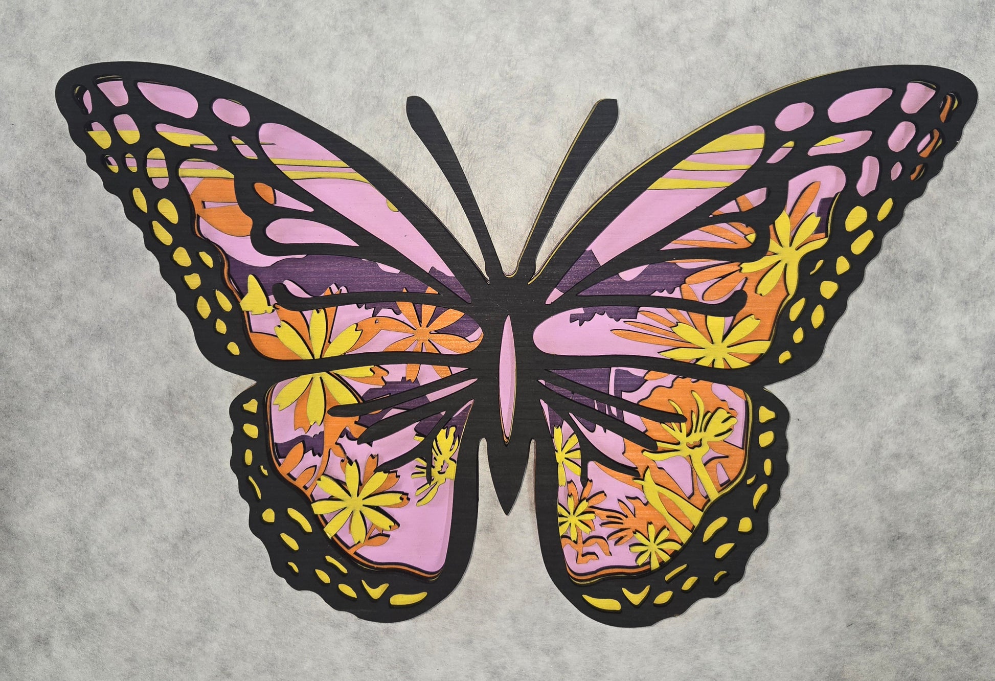 Multi-layered wall art that transcends traditional display limitations. This versatile multi-layered Butterfly functions seamlessly as a standalone accent for tables, countertops, and mantles, or mounts elegantly on walls for dramatic visual impact. Crafted with dimensional layering that creates depth and sophistication, it adapts to any interior design scheme. Whether you're seeking a focal point for a shelf, a statement piece above a fireplace, or a gallery wall installation, this art delivers professiona